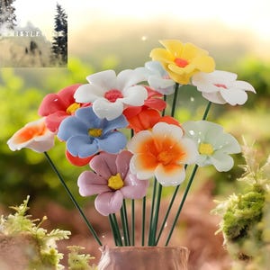 May include: A vibrant bouquet of artificial flowers in shades of white, yellow, red, orange, blue, and pink. The flowers are displayed in a brown vase with green stems, set against a blurred green backdrop.