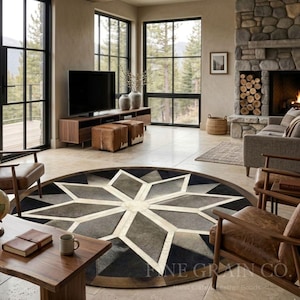 May include: A large circular rug featuring a geometric star pattern in shades of black, gray, and cream. The rug is composed of stitched leather panels arranged in a radial design with a central cream-colored star and alternating dark segments.