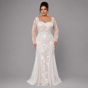 May include: A floor-length, long-sleeved gown featuring a sweetheart neckline and a corset-style bodice. The dress is crafted from a sheer, light-colored fabric adorned with intricate white floral embroidery and sequins throughout the entire garment.