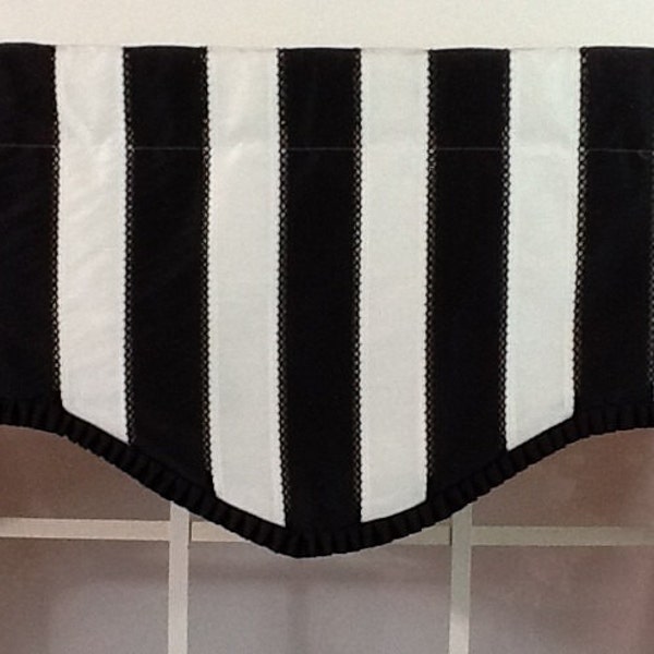 Black and white striped shaped valance with black pleated French pleated ribbon trim and optional  curtain rod