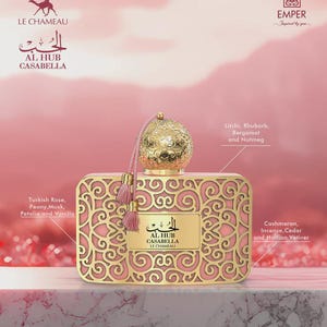 May include: A pink and gold perfume bottle with intricate filigree design. The bottle features a gold cap with a tassel and contains the text "AL HUB CASABELLA". The image includes the scent notes: Turkish Rose, Peony, Musk, Petalia, Vanilla, Litchi, Rhubarb, Bergamot, Nutmeg, Cashmeran, Incense, Cedar, and Haitian Vetiver.