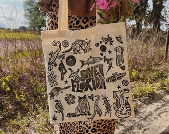Save Florida canvas tote bag linocut stamped with native plants and animals