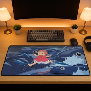 May include: A rectangular mousepad featuring a vibrant illustration of a character in a red dress running on top of blue ocean waves and large blue fish. The design is set against a dark, stormy sky.