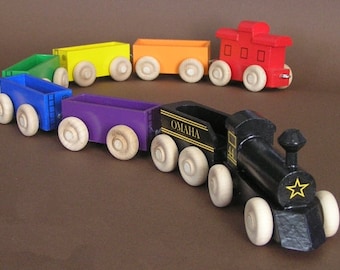 Wooden Toy Rainbow Train with black locomotive.