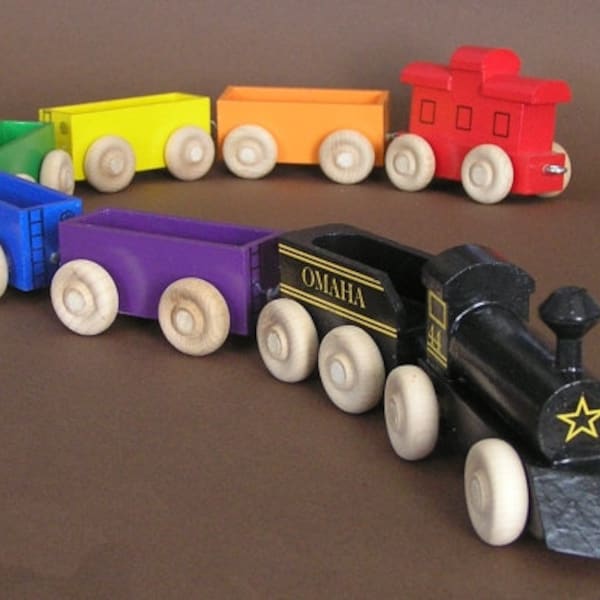 Wooden Toy Rainbow Train with black locomotive.