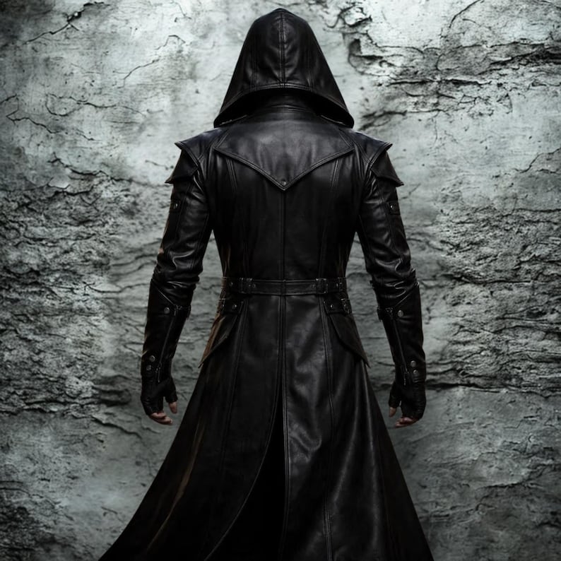 May include: A long, black leather hooded coat with a tailored fit. The coat features a belt at the waist, shoulder accents, and buttoned sleeves. The model is shown from the back, against a textured gray background.