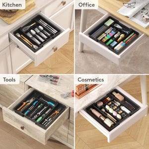 May include: Four drawer organizers, each filled with different items. The top left drawer contains kitchen utensils. The top right drawer holds office supplies. The bottom left drawer is filled with tools. The bottom right drawer contains cosmetics.