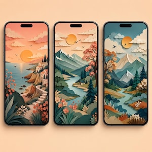 May include: Three phone cases with landscape art. Each case features a different scenic view: a coastal town at sunset, a river winding through mountains, and a mountain scene with a lake. The cases have black borders and display colorful illustrations.