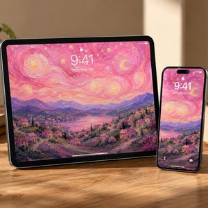 Pode incluir: Um tablet e um smartphone exibem uma vibrante pintura de paisagem rosa e roxa com uma vila e um lago. A hora 9:41 é exibida em ambas as telas. Os dispositivos estão em uma superfície de madeira.