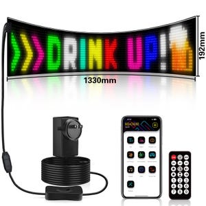May include: A curved LED sign displaying "DRINK UP!" in colorful lights, measuring 1330mm wide and 192mm high. Includes a power adapter, a smartphone with an app interface, and a remote control.