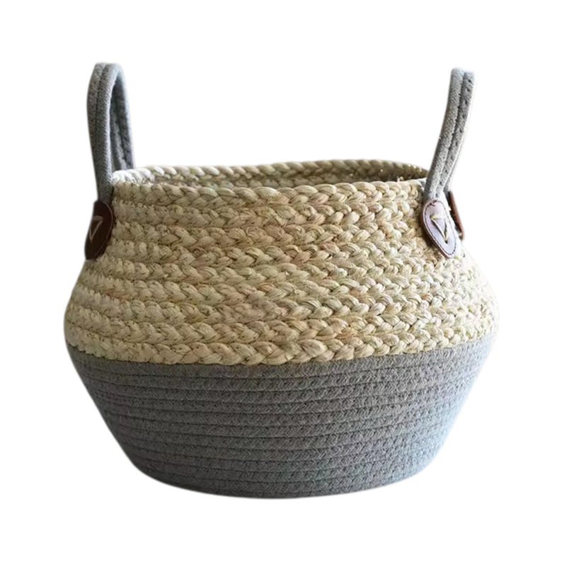 May include: A round storage basket featuring a two-tone design with a natural tan woven upper section and a solid gray rope-coiled base. The basket includes two upright gray fabric handles attached with small brown triangular faux leather accents.
