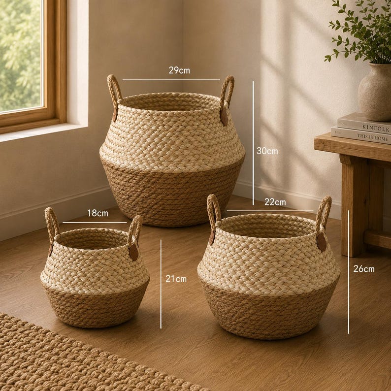 May include: Three round woven baskets with two handles each, featuring a two-tone design of light beige and natural tan. The largest basket measures 29 cm wide by 30 cm high, the medium is 22 cm wide by 26 cm high, and the smallest is 18 cm wide by 21 cm high.