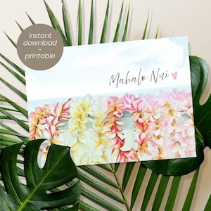 May include: A rectangular print featuring a watercolor illustration of multiple plumeria flower leis in shades of yellow, orange, and pink. The text Mahalo Nui with a small pink heart is centered above the leis against a light blue sky background.