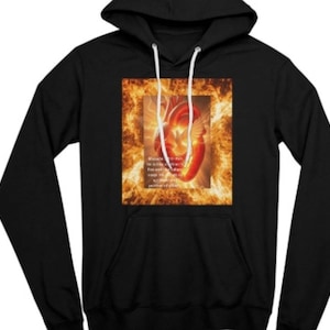 May include: Black hoodie with a front graphic of a heart with wings, set against a fiery background. The graphic includes text. The hoodie has a drawstring hood and a front pocket.