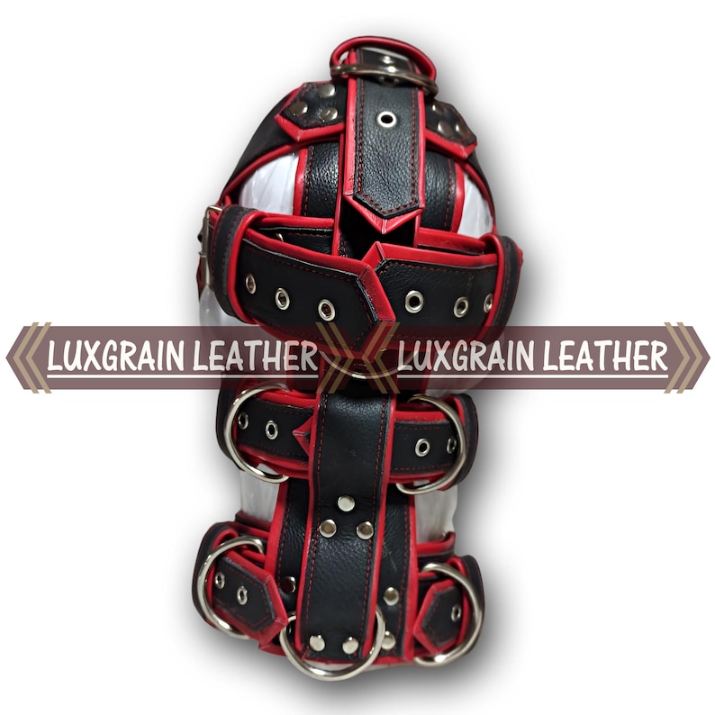 May include: A black and red leather hood with multiple straps and metal rings. The hood has a white interior and the text "LUXGRAIN LEATHER" is displayed on the side.