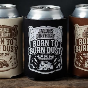 May include: Three beverage can coolers in beige, black, and brown, each with a silver can inside. The coolers feature the text "Jasons Birthday Born to Burn Dust 4x4 or Die" with a graphic of a jeep.