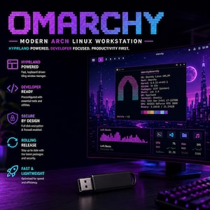 May include: A black USB flash drive sits in front of a computer monitor displaying the Omarchy Linux operating system interface. The screen shows system specifications, a city skyline wallpaper, and text detailing Hyprland, developer tools, and security features.