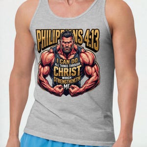 May include: A gray tank top with a graphic of a muscular man flexing. The graphic includes the text "PHILIPPIANS 4:13" in gold lettering and the phrase "I CAN DO ALL THINGS THROUGH CHRIST WHICH STRENGTHENETH ME."