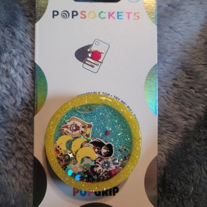 Cute anime shaker phone grippy or badgereel