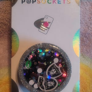 Cute football shaker phone grippy or badgereel
