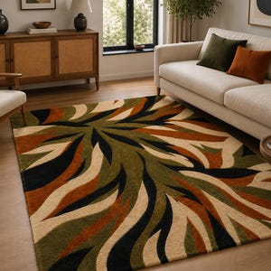 May include: A rectangular area rug featuring a bold, abstract pattern of sweeping, leaf-like shapes in shades of olive green, burnt orange, cream, and black. The design radiates from the center, creating a dynamic, flowing visual effect across the surface.