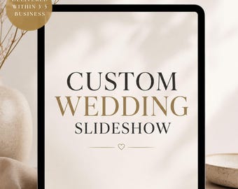 May include: A digital tablet screen displaying the text CUSTOM WEDDING SLIDESHOW in dark serif font, centered above a small heart icon and a horizontal line. The background of the screen is a light cream color with a black border frame.