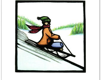 1 Christmas Card from a Linocut depicting a Winter Scene of Someone Sledding Down a Hill