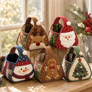 May include: Five quilted fabric baskets featuring holiday designs including a reindeer, Santa Claus, a snowman, a gingerbread person, and a Christmas tree. Each basket has a triangular shape, a single handle with a pom-pom, and patchwork sides.