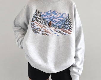Sudadera Sasquatch de inspiración vintage, estampado de Bigfoot en la montaña nevada, jersey de bosque invernal
