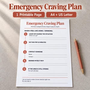 May include: A white printable Emergency Craving Plan sheet with rust-colored text and numbered steps from one to five. The document includes lines for writing responses and a rust-colored pen is placed to the right of the paper on the surface.