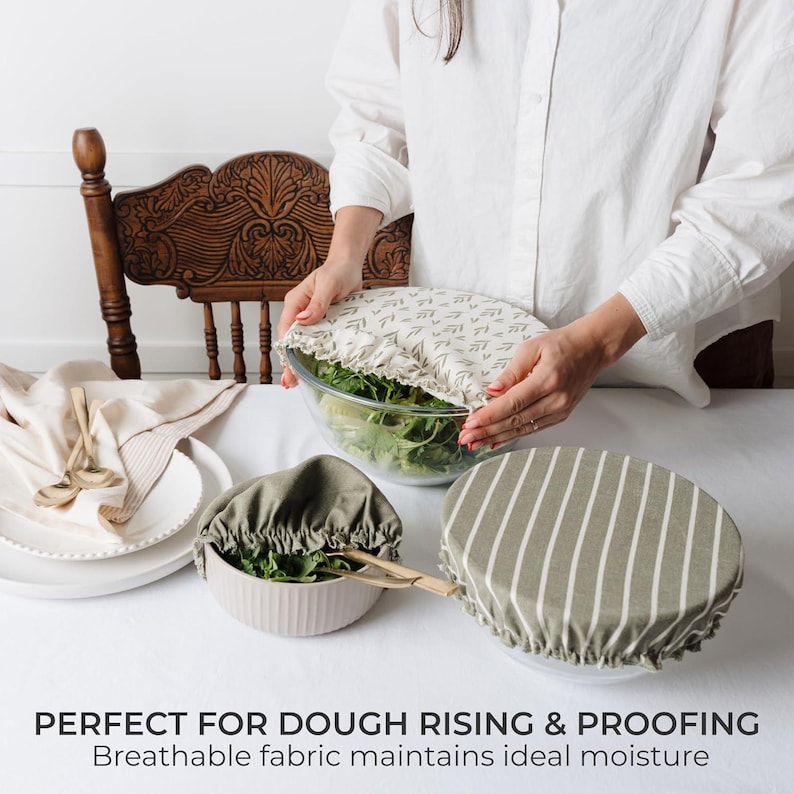 May include: Three round fabric bowl covers with elastic edges. One cover has a cream background with a small green leaf pattern, while the other two are solid olive green, one featuring white vertical stripes. Text reads: PERFECT FOR DOUGH RISING & PROOFING.