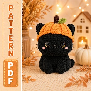 May include: A black crochet cat wearing an orange pumpkin hat. The cat has large, round eyes, pink cheeks, and a small smile. The image also includes the text "PATTERN PDF" in a vertical format.