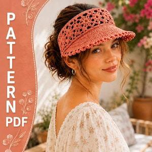 May include: A coral-colored crochet visor featuring a detailed floral pattern and a scalloped edge. The text PATTERN PDF is displayed vertically on the left side of the image, accompanied by white line drawings of small flowers and stems.