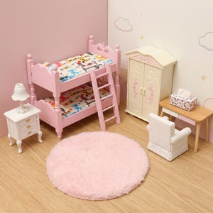 May include: A miniature bedroom set featuring a pink wooden bunk bed with a ladder, a white nightstand with a lamp, a cream-colored wardrobe, a small wooden desk with a tissue box, a white textured armchair, and a round, fluffy pink area rug.