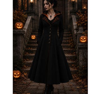 May include: A long black coat with a flared skirt, featuring orange trim and decorative buttons. The coat is worn by a person standing in front of a stone staircase decorated with lit jack-o'-lanterns, creating a gothic Halloween theme.