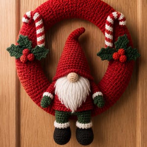 May include: A red crocheted wreath featuring two white and red striped candy canes and two green holly leaf clusters with red berries. A crocheted gnome with a red hat, white beard, red jacket, green trousers, and black boots is attached to the centre.