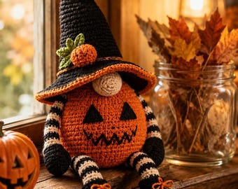 May include: A crocheted pumpkin gnome featuring a tall black pointed hat with an orange pumpkin accent, a round beige nose, and a spherical orange body with a stitched jack-o'-lantern face. It has black and white striped arms and legs with black shoes.