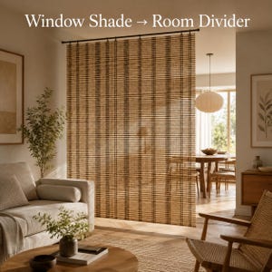 May include: A tall, rectangular bamboo room divider featuring a vertical striped pattern in shades of tan and dark brown. The screen is suspended from a thin black horizontal rod. The text "Window Shade → Room Divider" is printed at the top.