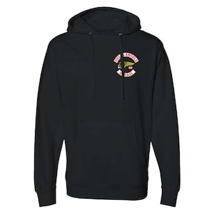May include: Black hooded sweatshirt with a kangaroo pocket and a small patch on the upper left chest. The patch features the words "HELLS ANGELS" in a curved red banner, with a winged skull emblem.