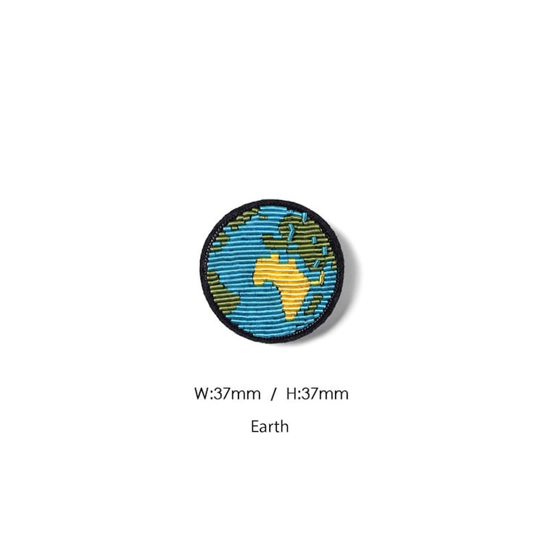May include: A circular embroidered patch featuring a stylized depiction of the Earth with blue oceans, green landmasses, and a yellow continent. The patch has a black border and measures 37mm in width and 37mm in height, with the text Earth printed below.