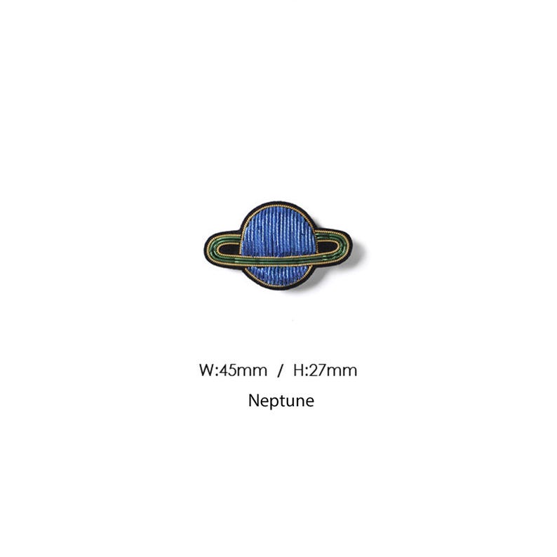 May include: An embroidered patch shaped like the planet Neptune with a blue sphere and green rings outlined in black thread. The text W:45mm / H:27mm and Neptune is printed below the patch, indicating a width of 45mm and a height of 27mm.