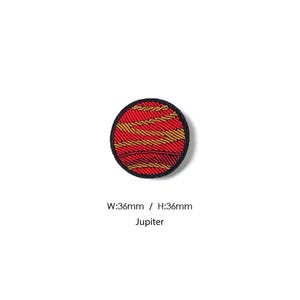May include: A circular embroidered patch depicting the planet Jupiter with red and gold swirling bands. The patch features a black border and includes the text W:36mm / H:36mm Jupiter below the design, indicating a width and height of 36mm.