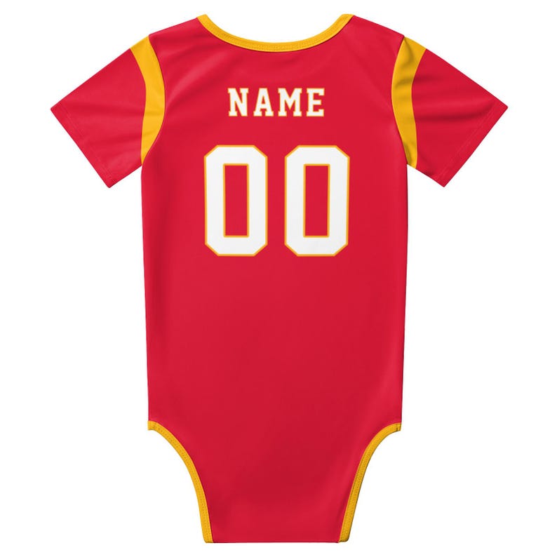May include: A red short-sleeved bodysuit with yellow trim on the neckline, sleeves, and leg openings. The back features the word NAME in white block letters above the large white numbers 00, which are outlined in a thin yellow border.