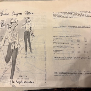 May include: A vintage Spadea Designer Pattern NA-2116 for a Jr. Sophisticates overblouse. The envelope features a black and white illustration of a person wearing a ruffled blouse and slim trousers, along with printed sizing and fabric requirements.