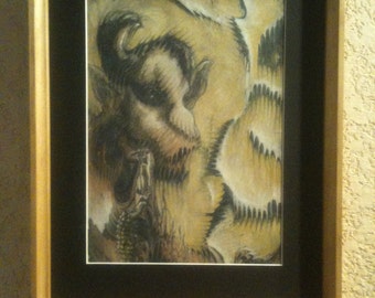 May include: A framed black and white drawing of a creature with a long snout and sharp teeth. The creature is surrounded by a swirling pattern of lines and shapes.