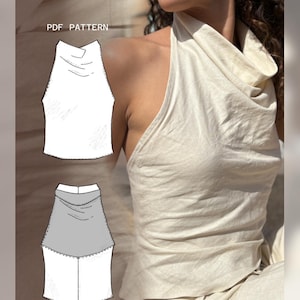 Puede incluir: Un top halter de color crema con cuello drapeado. La imagen también muestra un patrón PDF del top, con un diseño blanco y gris. El texto "PDF PATTERN" es visible en la esquina superior izquierda. El top está hecho de una tela suave y fluida.