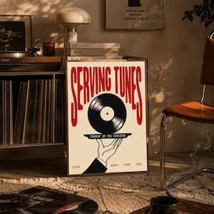 May include: A rectangular poster featuring the red text "SERVING TUNES" at the top. Below, a black and white illustration shows a hand holding a platter with a black vinyl record. The text "COOKIN' UP THE CLASSICS" appears on the platter, with "DISCO", "HOUSE", "FUNK", and "SOUL" printed at the bottom.