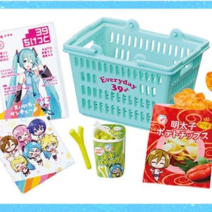 May include: A miniature scene featuring a light blue shopping basket with the text "Everyday 39♪", a magazine with a character illustration, a snack bag, a cup of peas, and a small towel with character illustrations.
