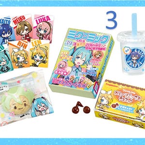 May include: A collection of Japanese anime-themed merchandise, including character cards, a magazine, a drink, and packaged snacks. The items feature colorful illustrations of anime characters and Japanese text. A number "3" is visible in the image.