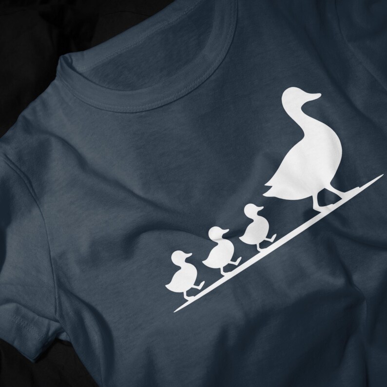 Cute duck family unisex shirt with simple white duckling illustration and cozy casual style.
